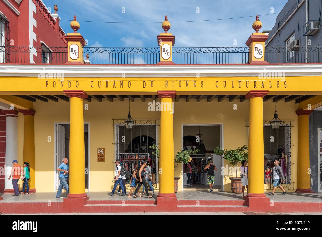 Cuban people in colonial porch building, Holguin, Cuba, 2016 Stock Photo