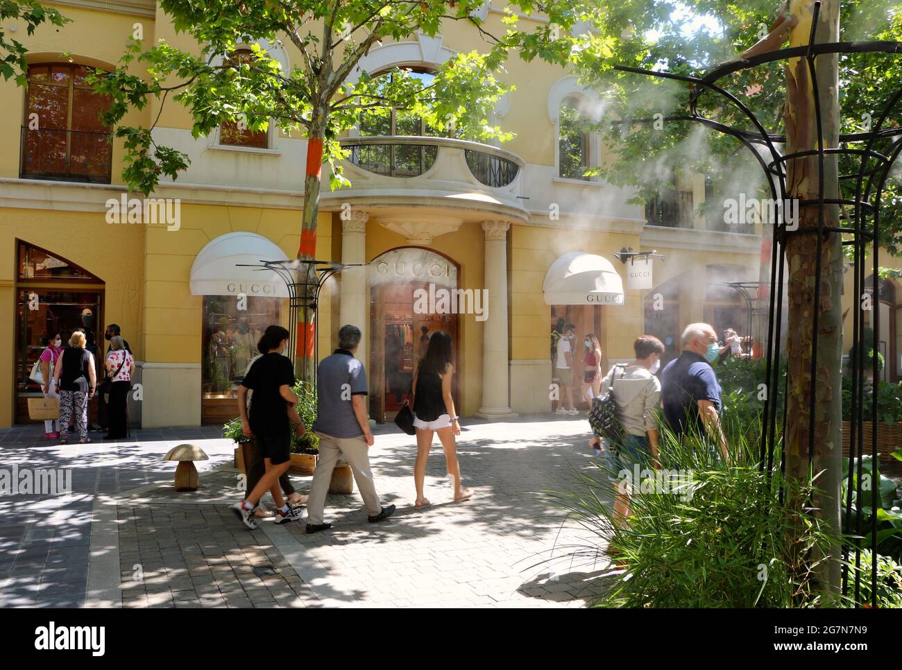 Gucci shop front Las Rozas Shopping Mall Madrid Spain with water vapour  sprayed to help with a hot day Stock Photo - Alamy