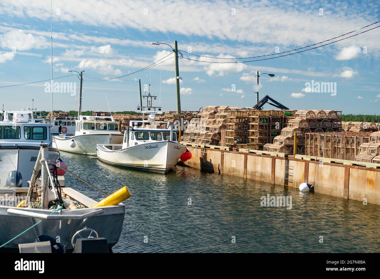 Lobster fishing boats tied up at the wharf in rural Prince Edward Island, Canada. Stock Photo