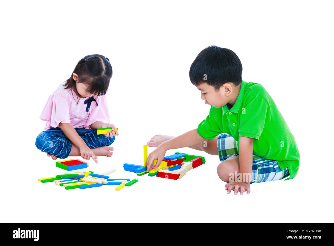 Happy asian children. Boy and girl playing toy wood blocks, isolated on white background