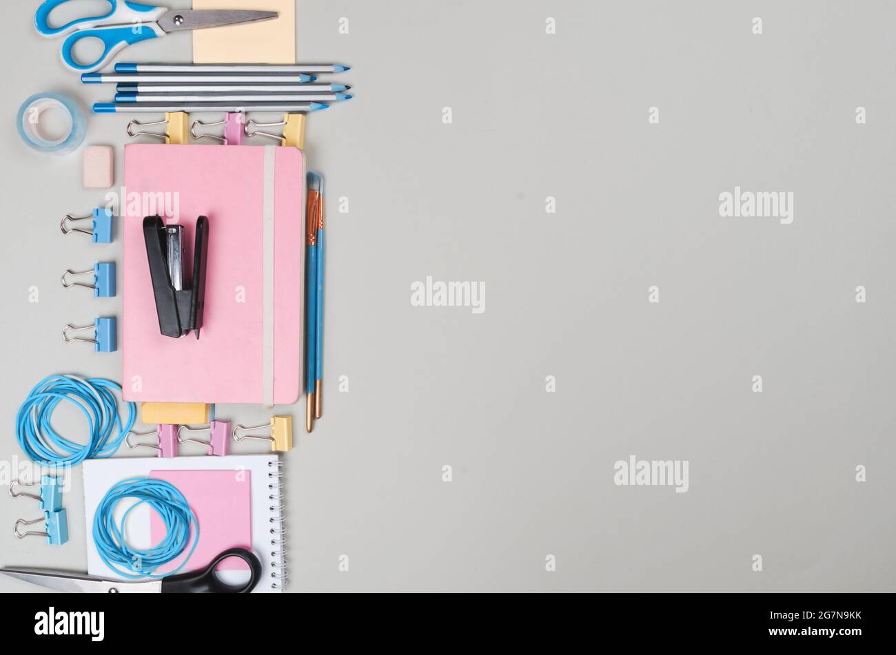 Different school supplies on light grey background Stock Photo