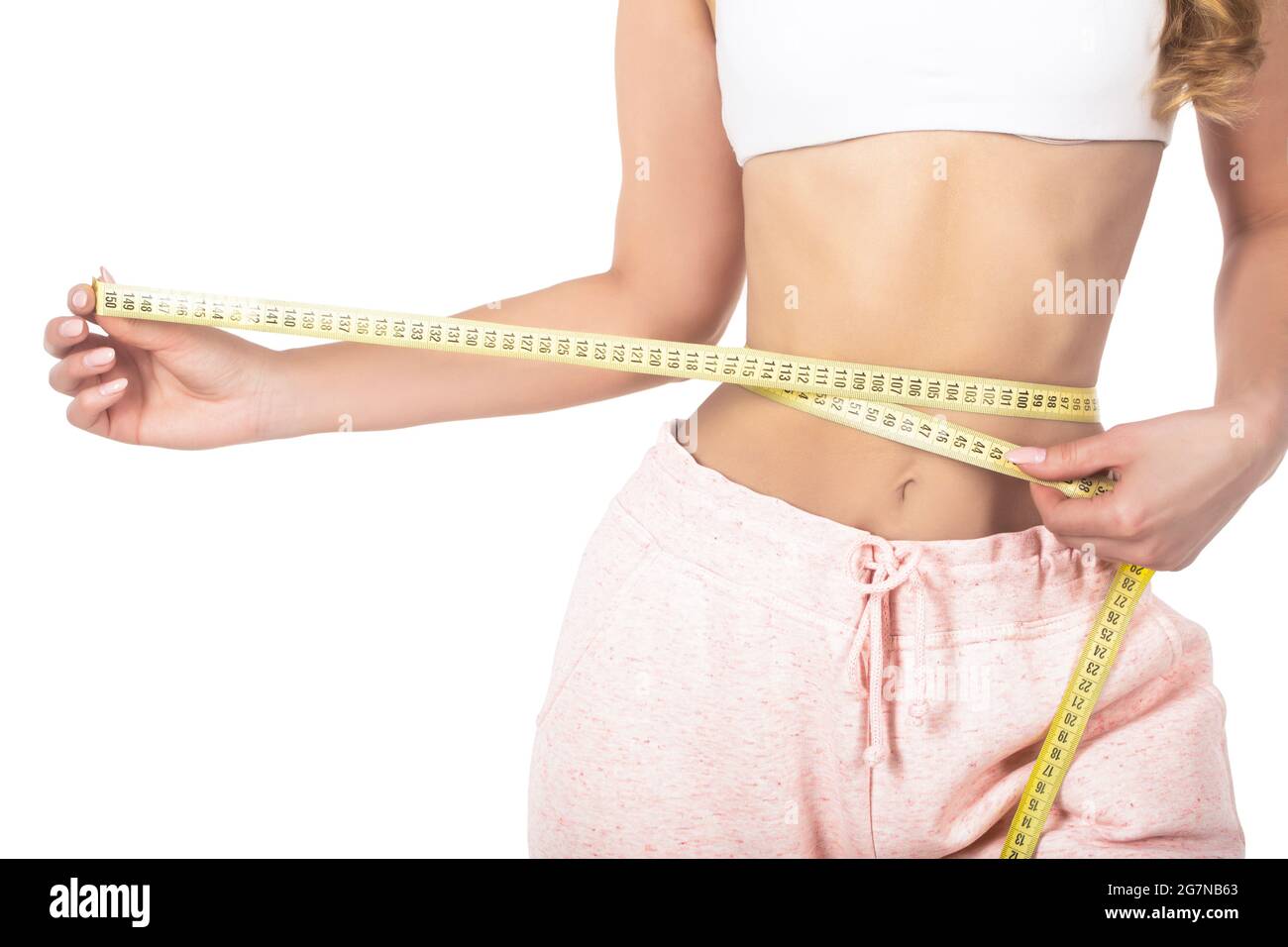 a guy with a big belly and a slim girl measuring waist measuring tape on a  white background Stock Photo, Waist Measuring Tape 