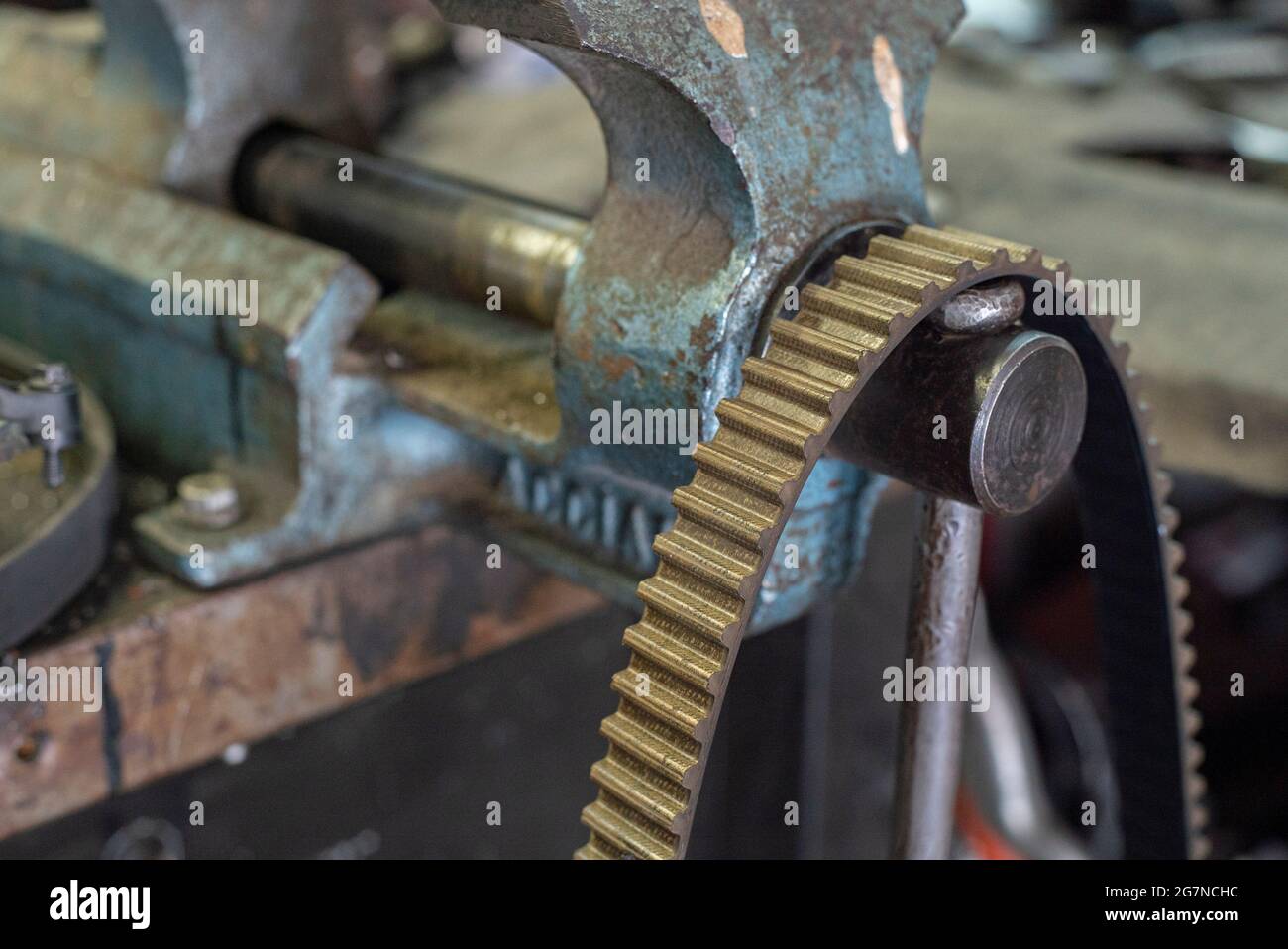 Old timing belt detail in a workshop bench Stock Photo