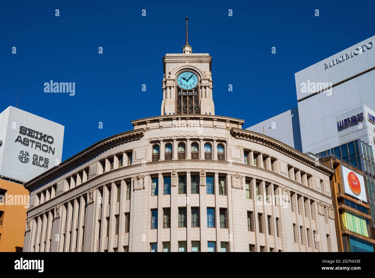 View of art deco Wako Building with its iconic Clocktower symbol of the Ginza fashion and boutique district in the very center of Tokyo Stock Photo