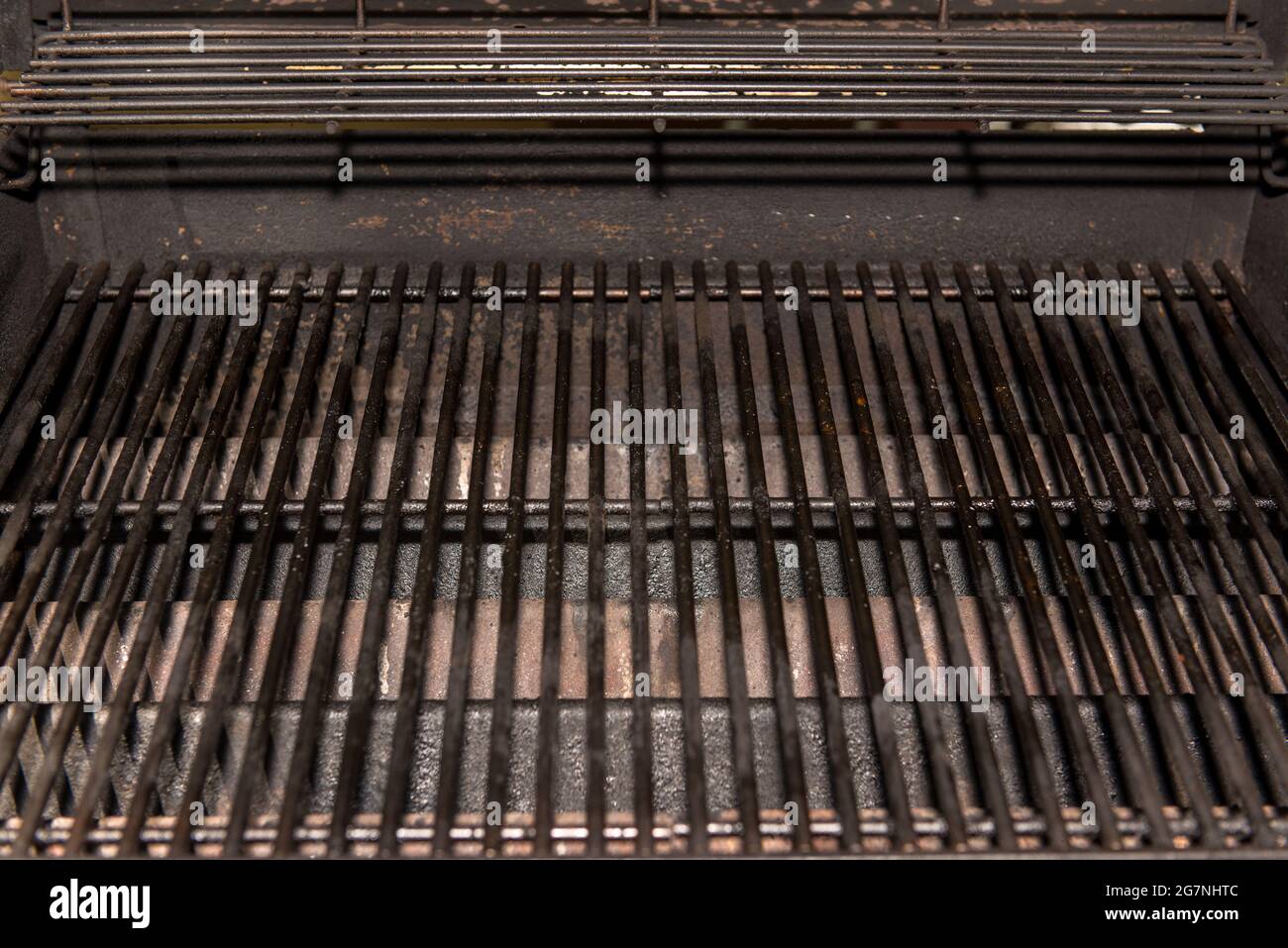 Old Empty Barbecue Grill Texture with a Thick Layer of Soot and Carbon. Dirty Iron Bbq Lattice Background Top View with Place for Text. Dark Key Photo Stock Photo