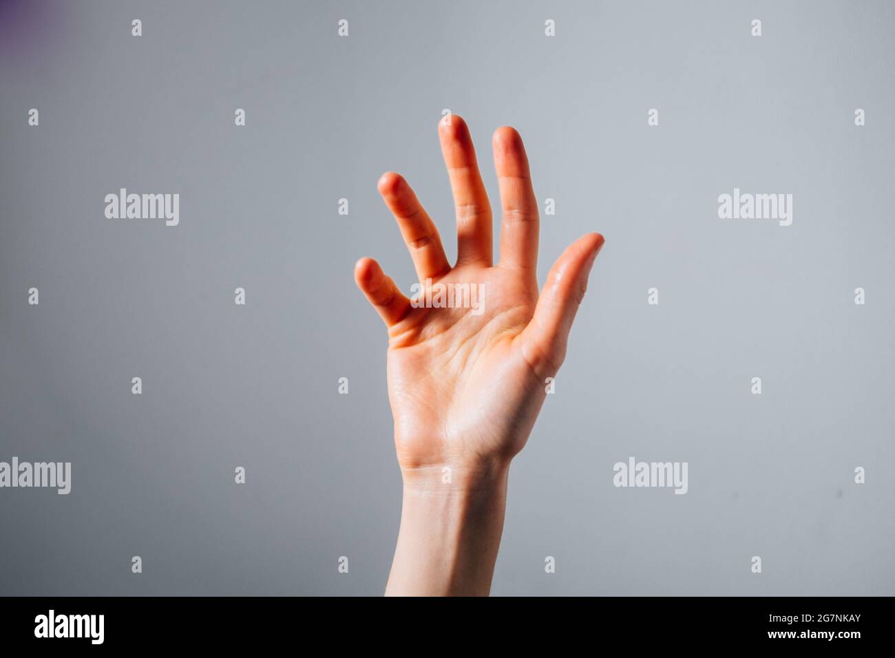 Hand Rased Up Human hand raised in hi-res stock photography and images - Alamy