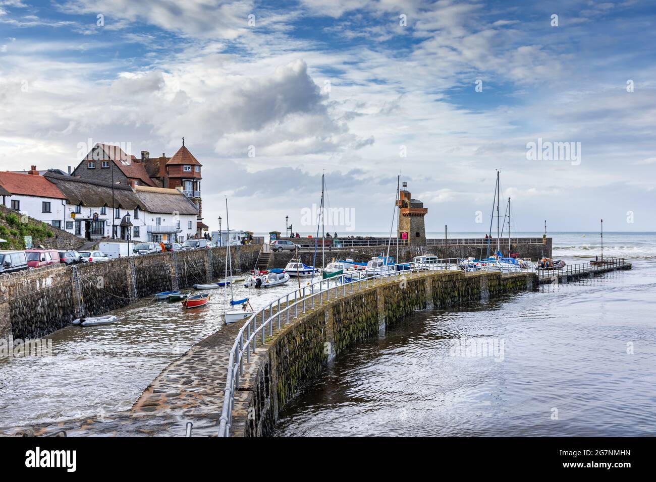 Lynmouth harbour at high tide with the Rhenish Tower on the harbour wall, North Devon, England. Stock Photo