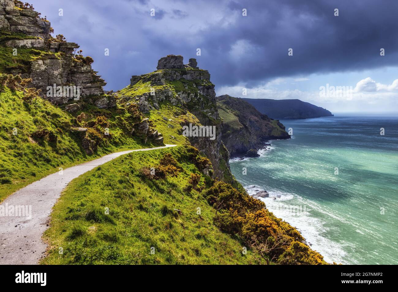 Wringcliff Bay near Castle Rock, Valley of the Rocks in the Exmoor National Park, from the South West Coast Path with heavy rainclouds approaching. Stock Photo