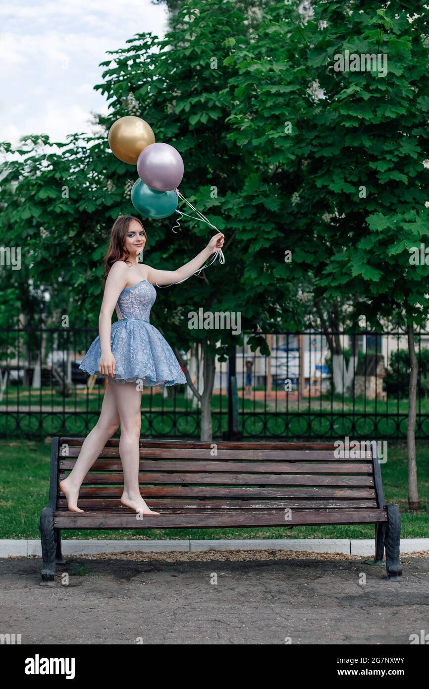 Woman walking barefoot street hi-res stock photography and images - Alamy