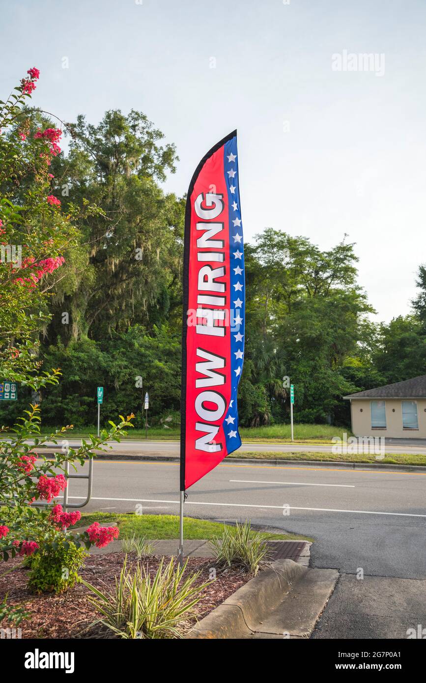 Now Hiring Sign and Banner displayed at a fast food restaurant in North Central Florida. Stock Photo
