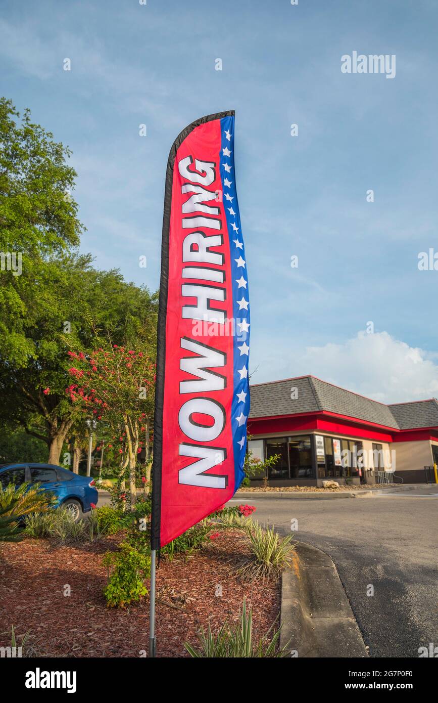 Now Hiring Sign and Banner displayed at a fast food restaurant in North Central Florida. Stock Photo