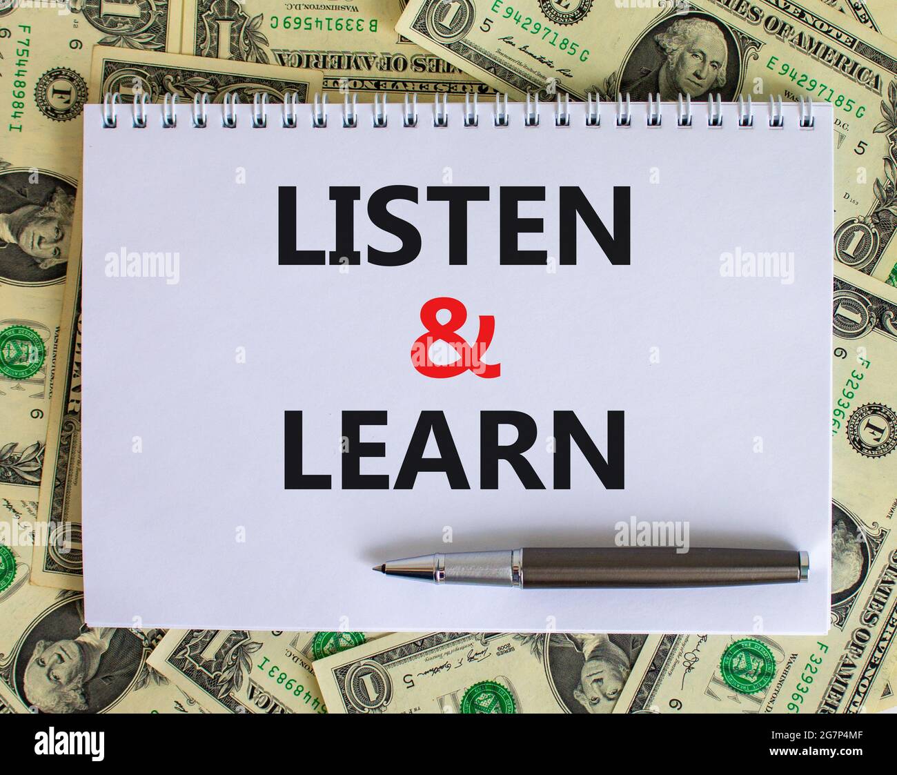 Listen and learn symbol. Words 'Listen and learn' on white note ...