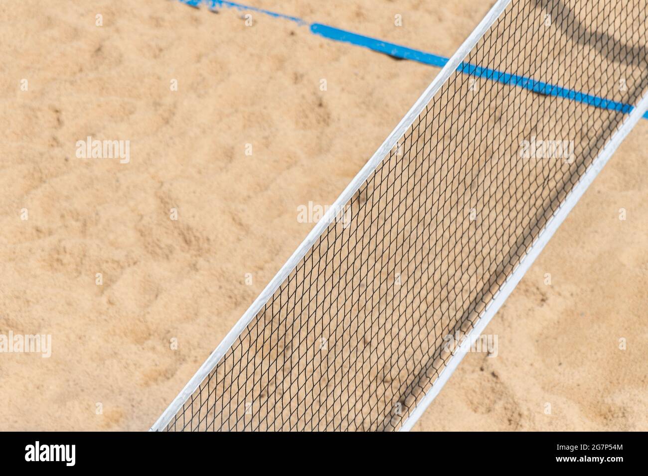 Beach volleyball and beach tennis net on the background of sand. Summer
