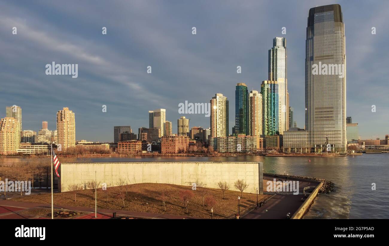 Aerial of Goldman Sachs building and the gold coast skyscrapers, with Jersey City 911 Memorial in the foreground at Liberty State Park. Stock Photo