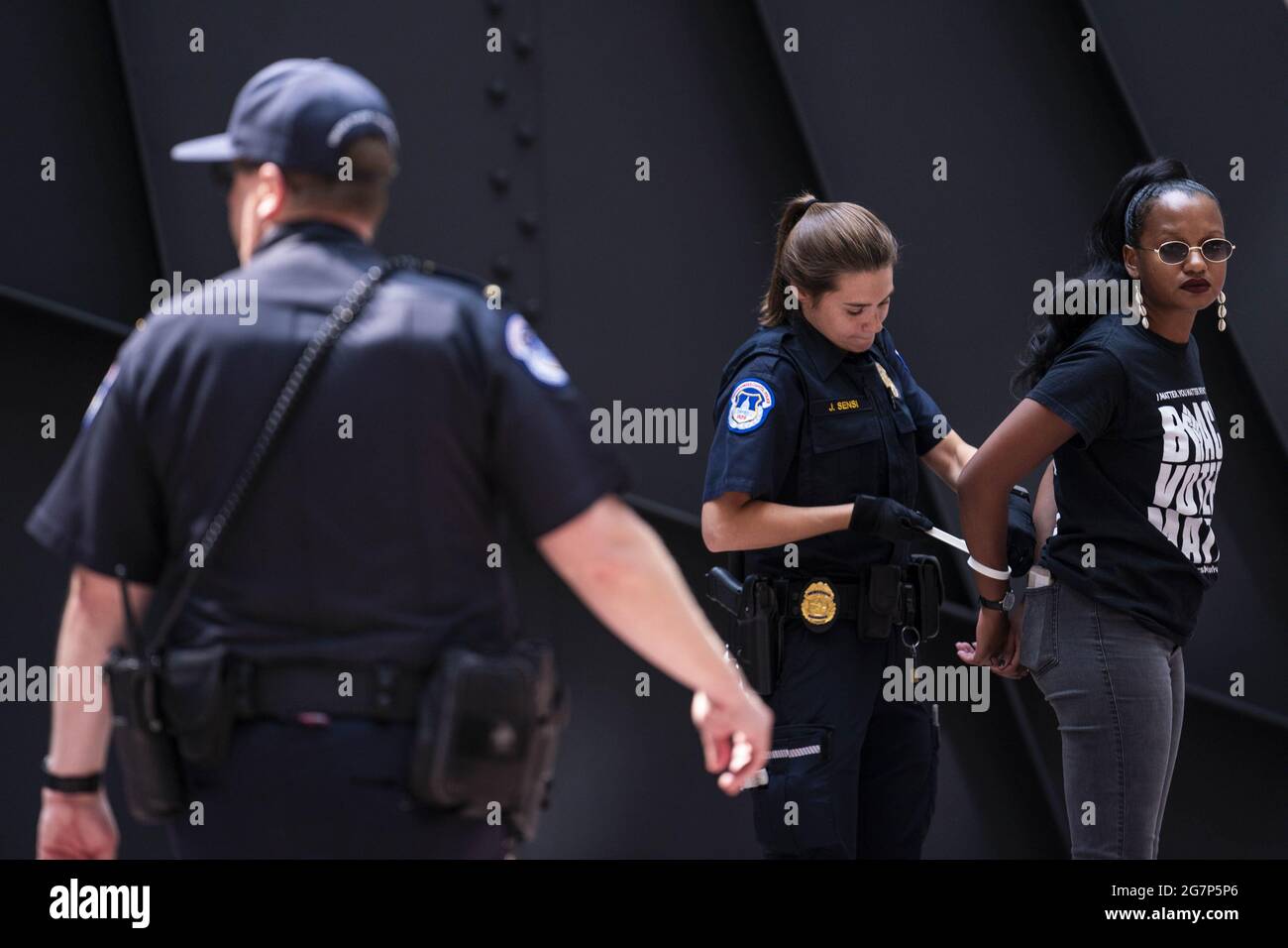 Washington, United States. 15th July, 2021. An activist is arrested during a protest in support of voting rights in the atrium of Hart Senate Office Building on Capitol Hill in Washington, DC on Thursday, July 15, 2021. Republican lawmakers around the country have introduced legislation that make it more difficult for voters to cast ballots. Photo by Sarah Silbiger/UPI Credit: UPI/Alamy Live News Stock Photo