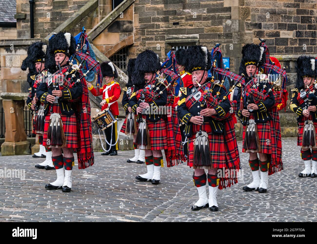 Royal Scots Guards military pipers playing bagpipes in kilt uniforms at Edinburgh Castle in a military ceremony, Scotland, UK Stock Photo