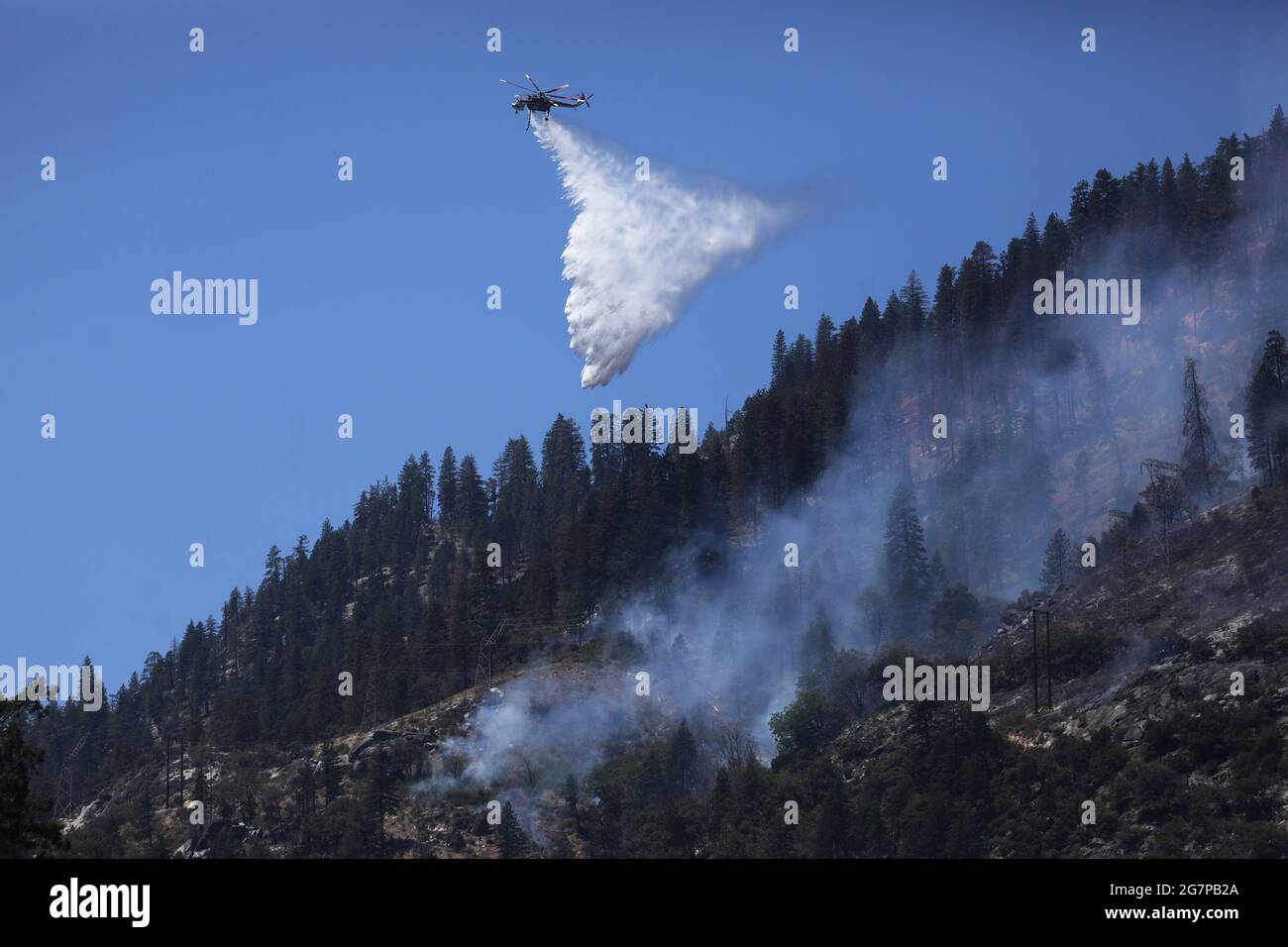 Air support drops water from the Feather River as the Dixie Fire grows in Plumas National Forest, California, U.S., July 15, 2021.  REUTERS/David Swanson Stock Photo