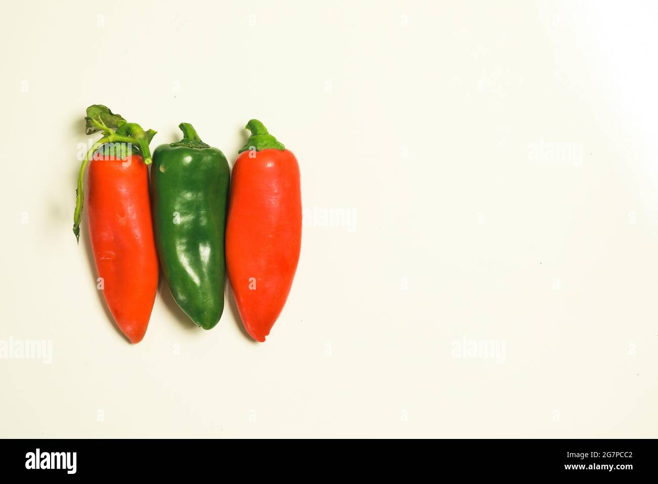 Top view of a blank background with red and green chili peppers Stock ...