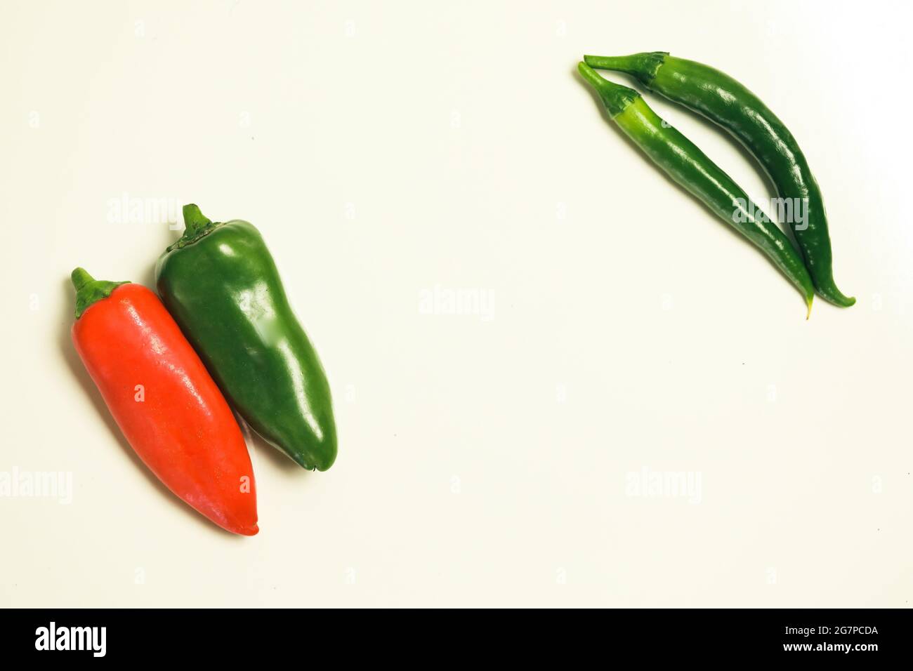 Top view of red and green chili peppers on a blank background Stock ...