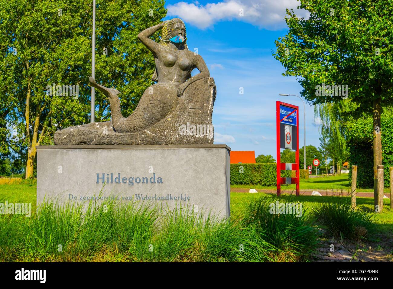 The popular mermaid statue hildegonda of waterlandkerkje wearing a face