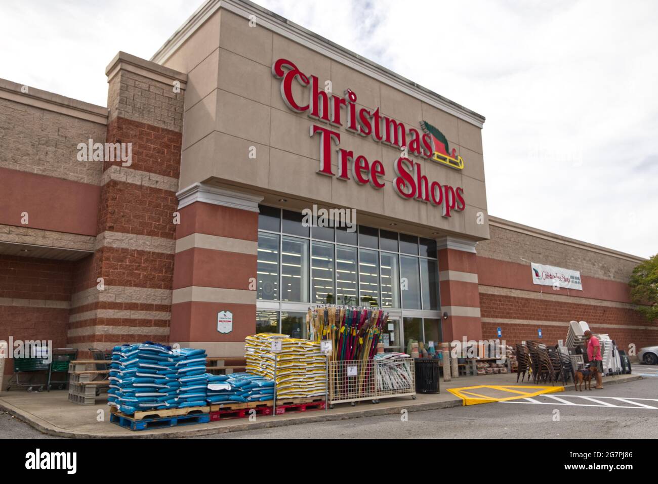 Augusta, Ga USA 04 30 21 Man with a dog of Christmas Tree Shops