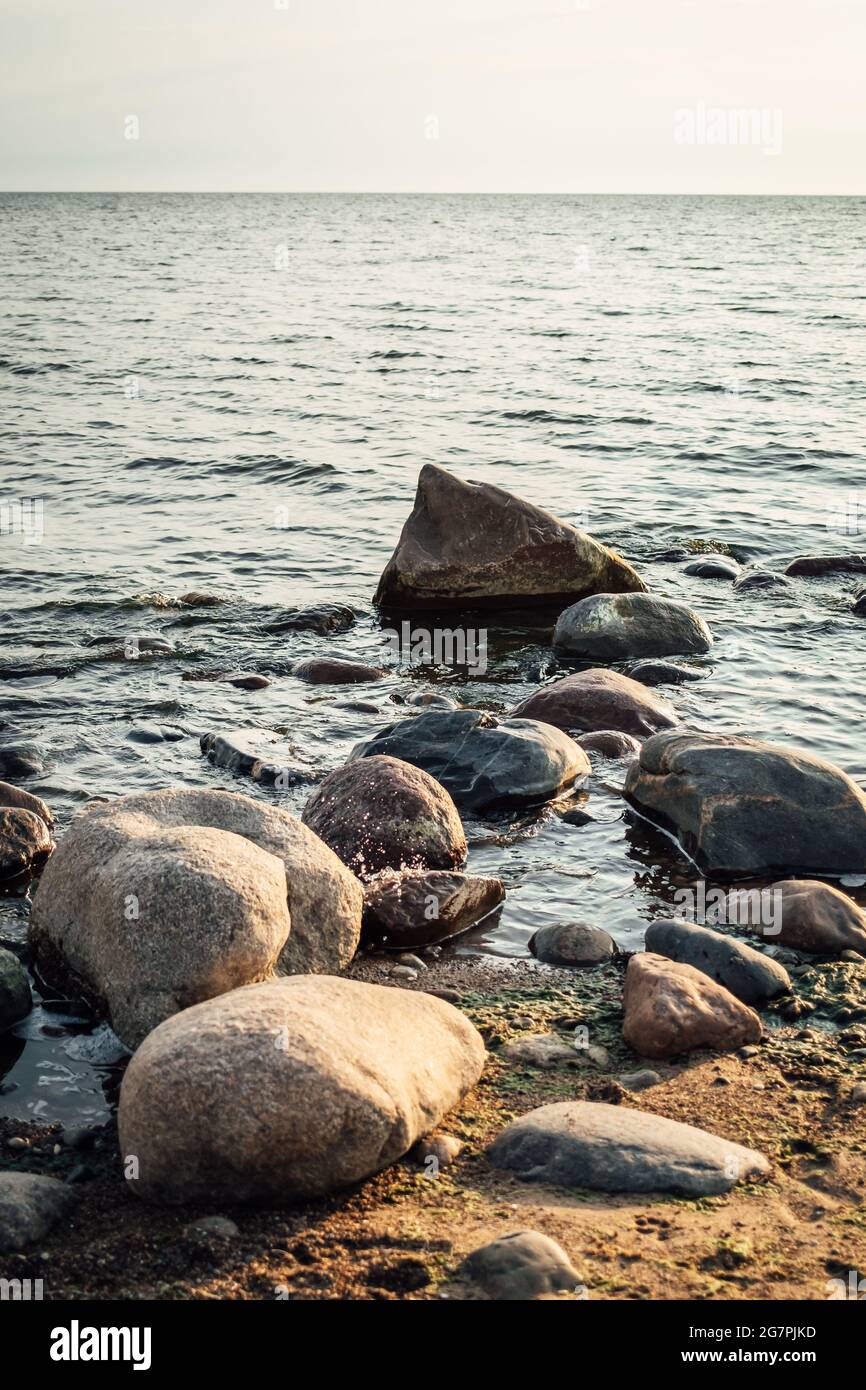 Beautiful scenery of the beach with splashing sea waves Stock Photo - Alamy