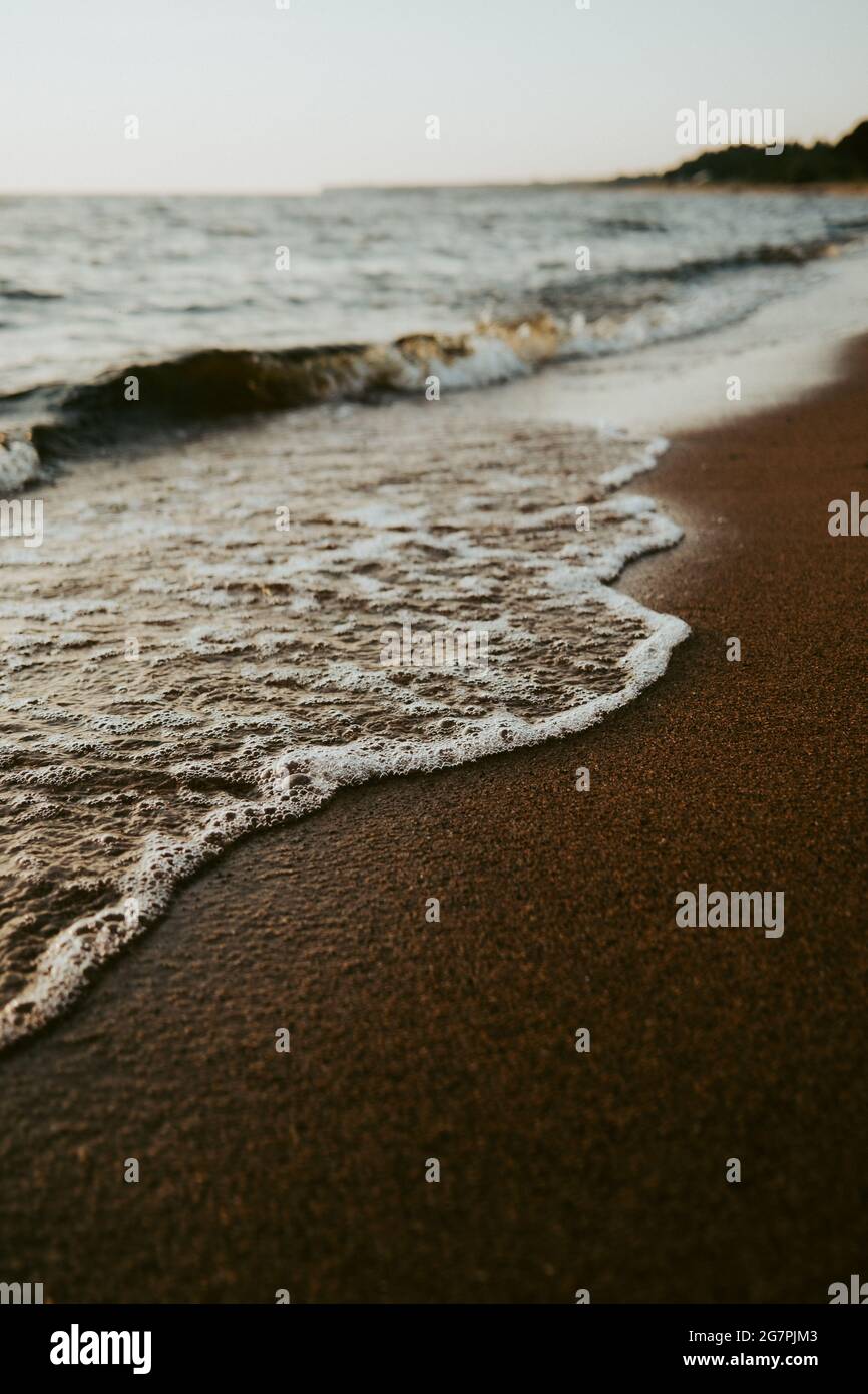 Beautiful scenery of the beach with splashing sea waves Stock Photo - Alamy