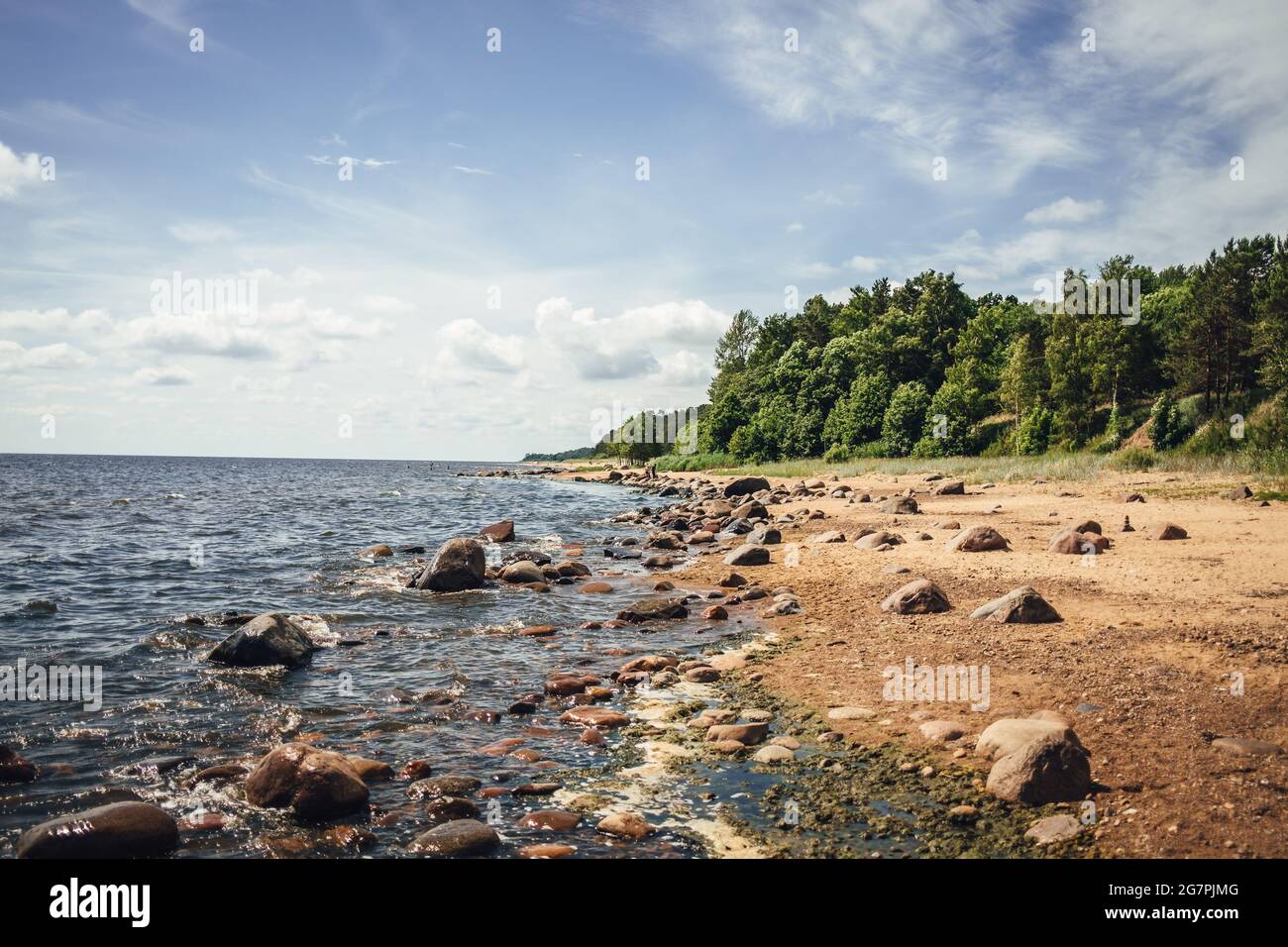 Beautiful scenery of the beach with splashing sea waves Stock Photo - Alamy