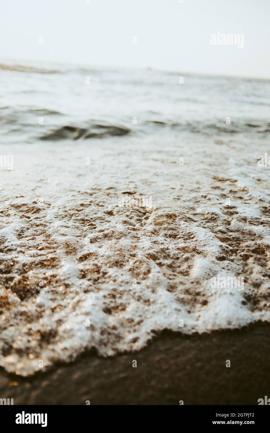 Beautiful scenery of the beach with splashing sea waves Stock Photo - Alamy