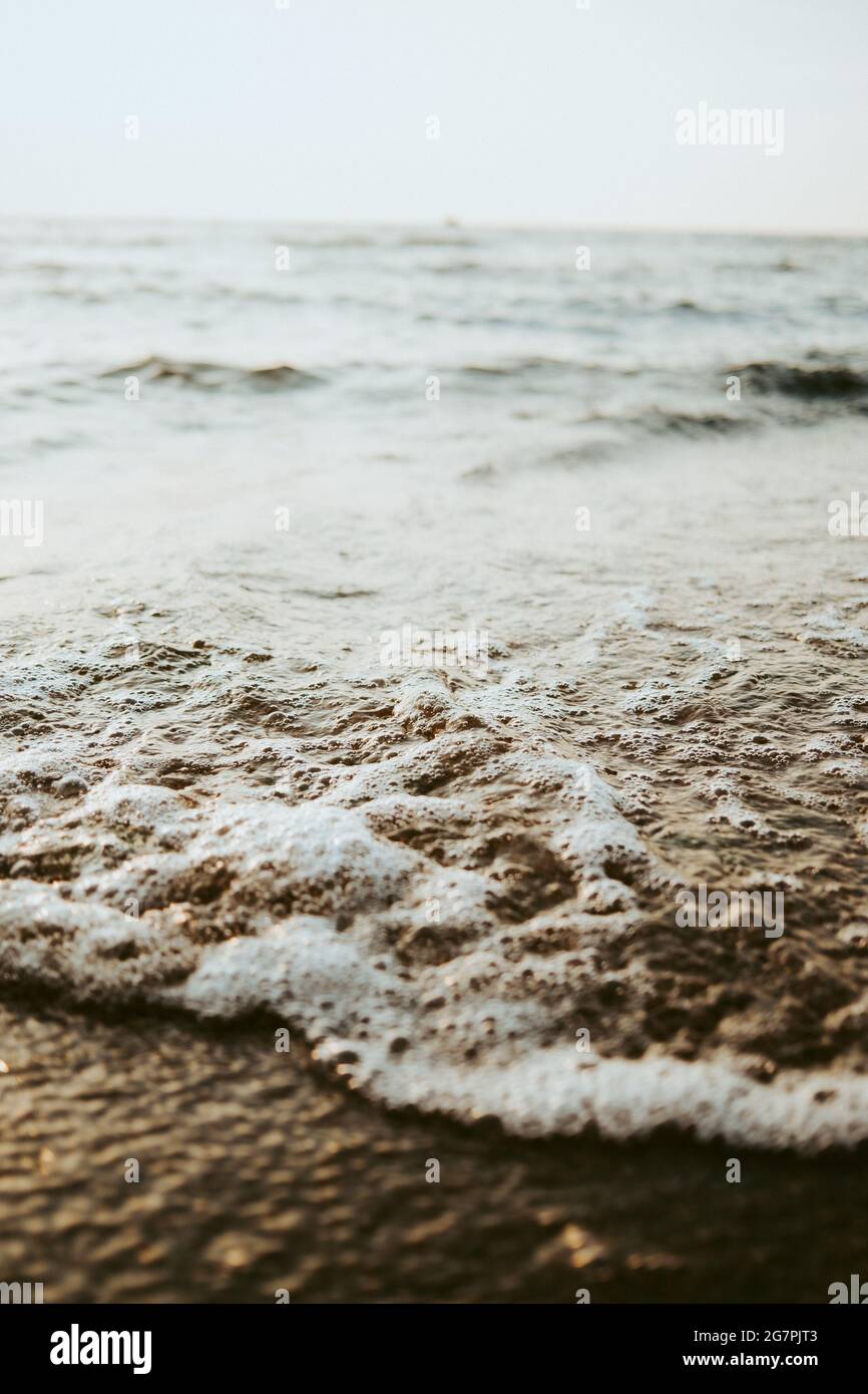 Beautiful scenery of the beach with splashing sea waves Stock Photo - Alamy