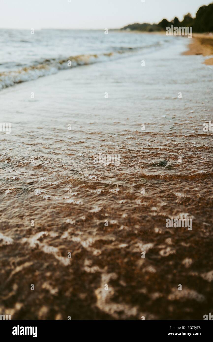 Beautiful scenery of the beach with splashing sea waves Stock Photo - Alamy