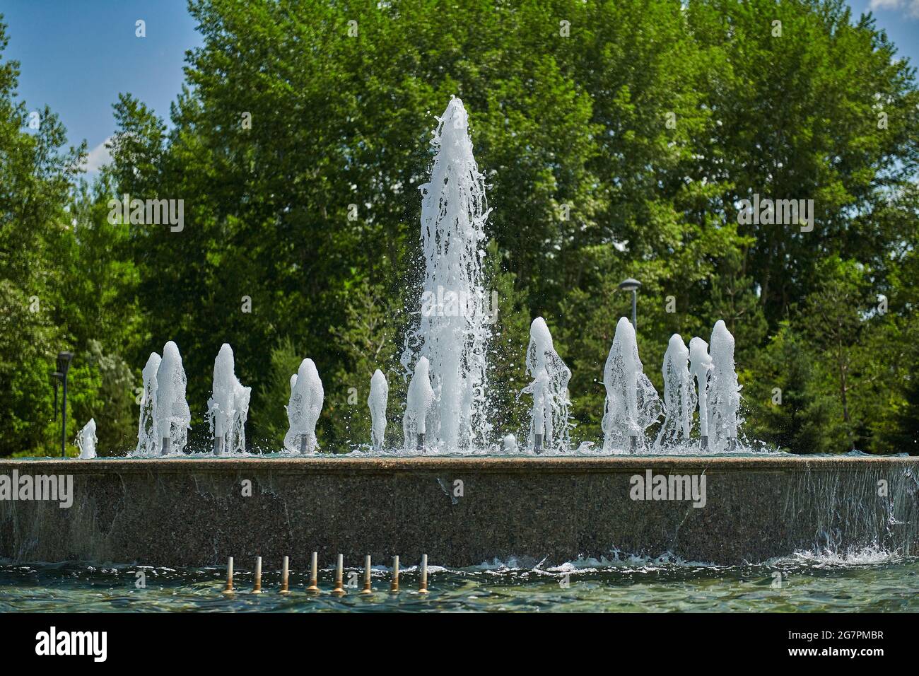 big city beautiful fountain in the park is working Stock Photo - Alamy