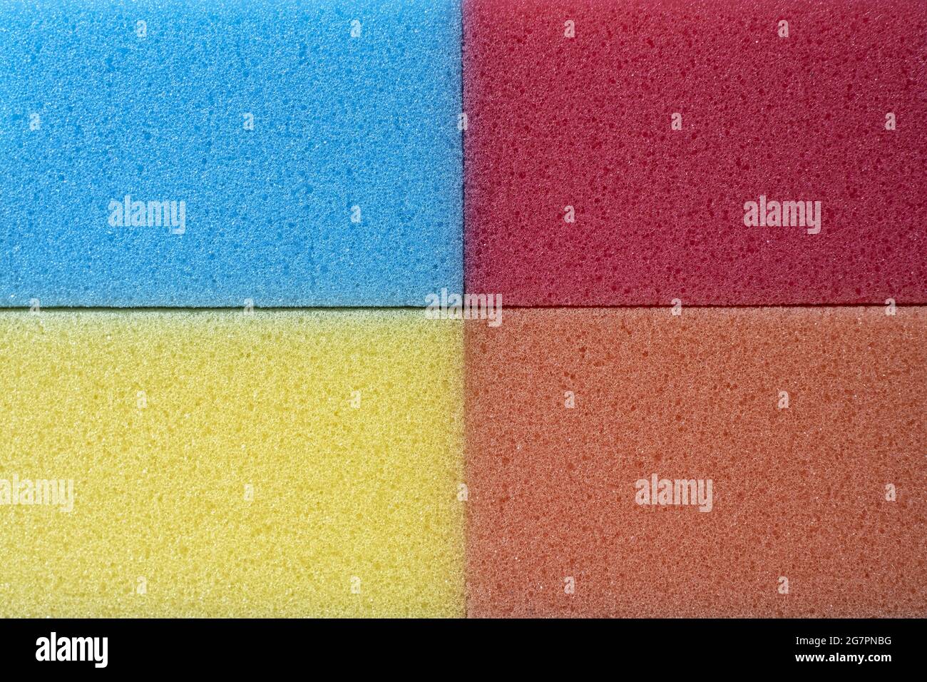 Multi Colored Stacked Kitchen Cellulose Foam Sponges. macro household sponge for cleaning Backgroun Stock Photo