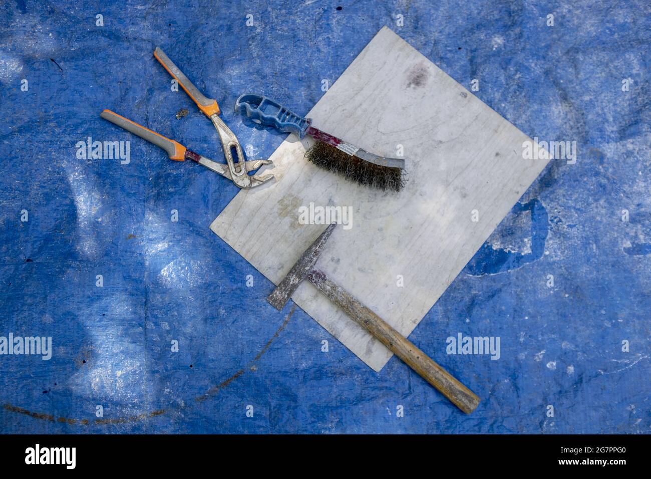 Bronze casting process and manual labor concept. Stock Photo