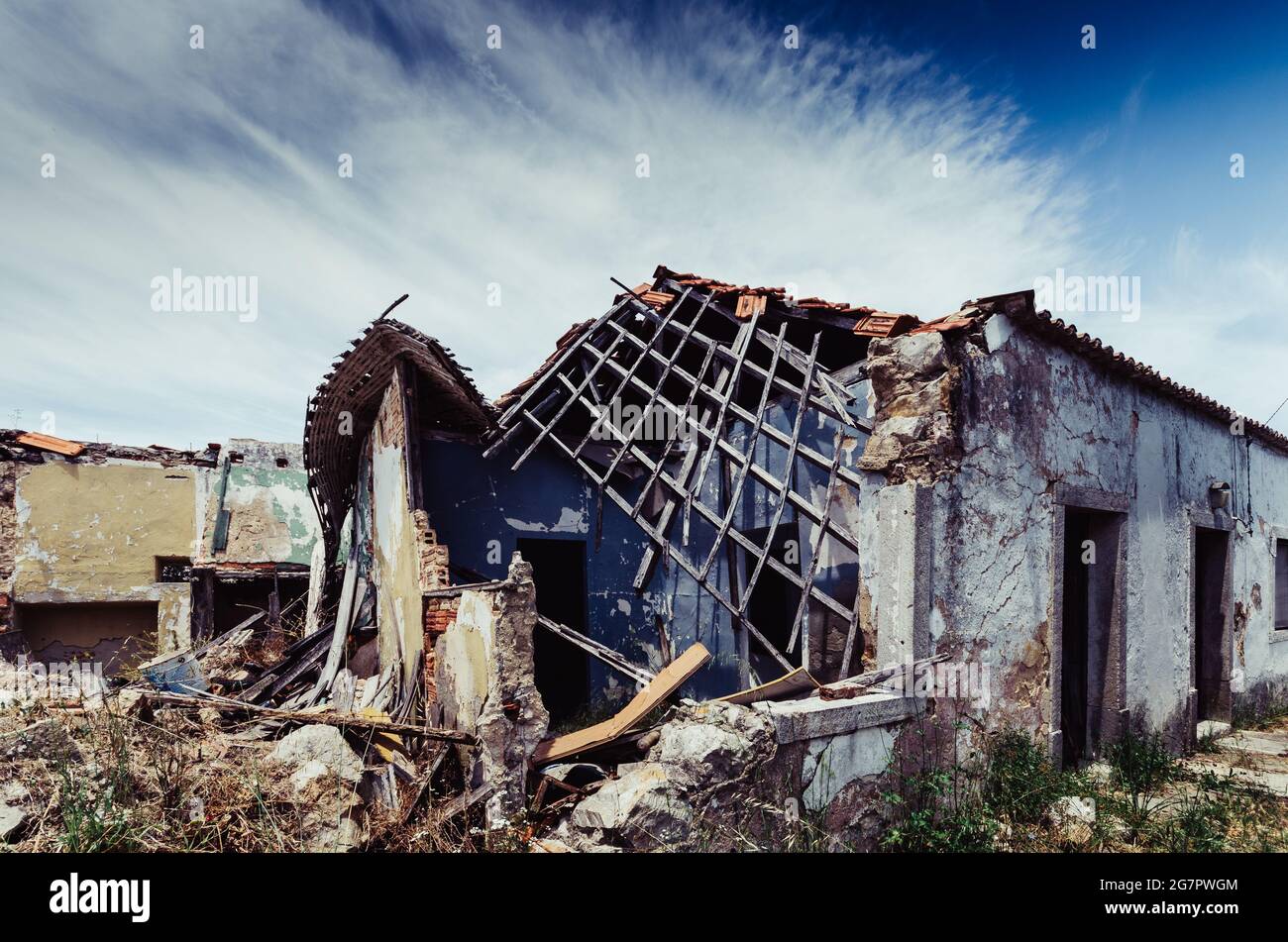 Ruins of abandoned buildings under a cloudy sky Stock Photo - Alamy