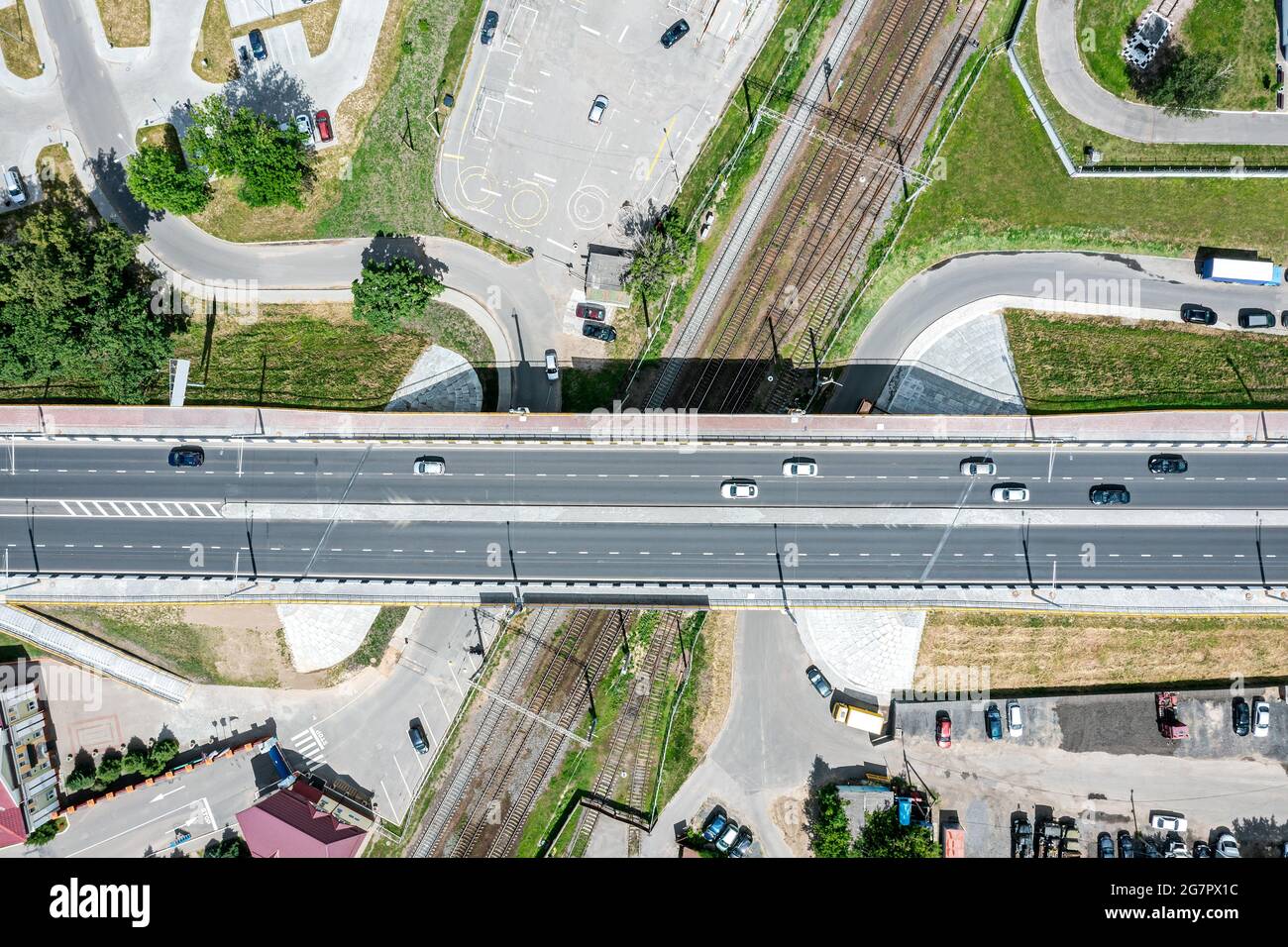bird's eye view of road bridge crossing rail tracks. transportation background. Stock Photo