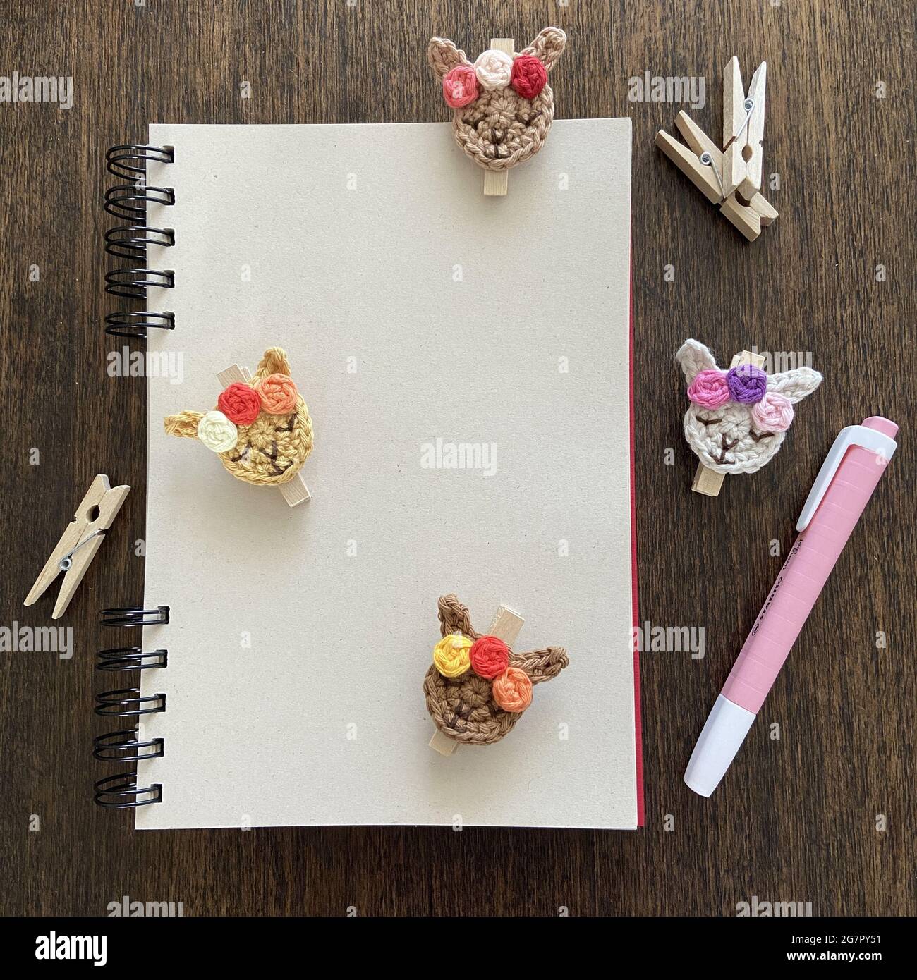 Top view of a blank notepad with space for text on the table with ...
