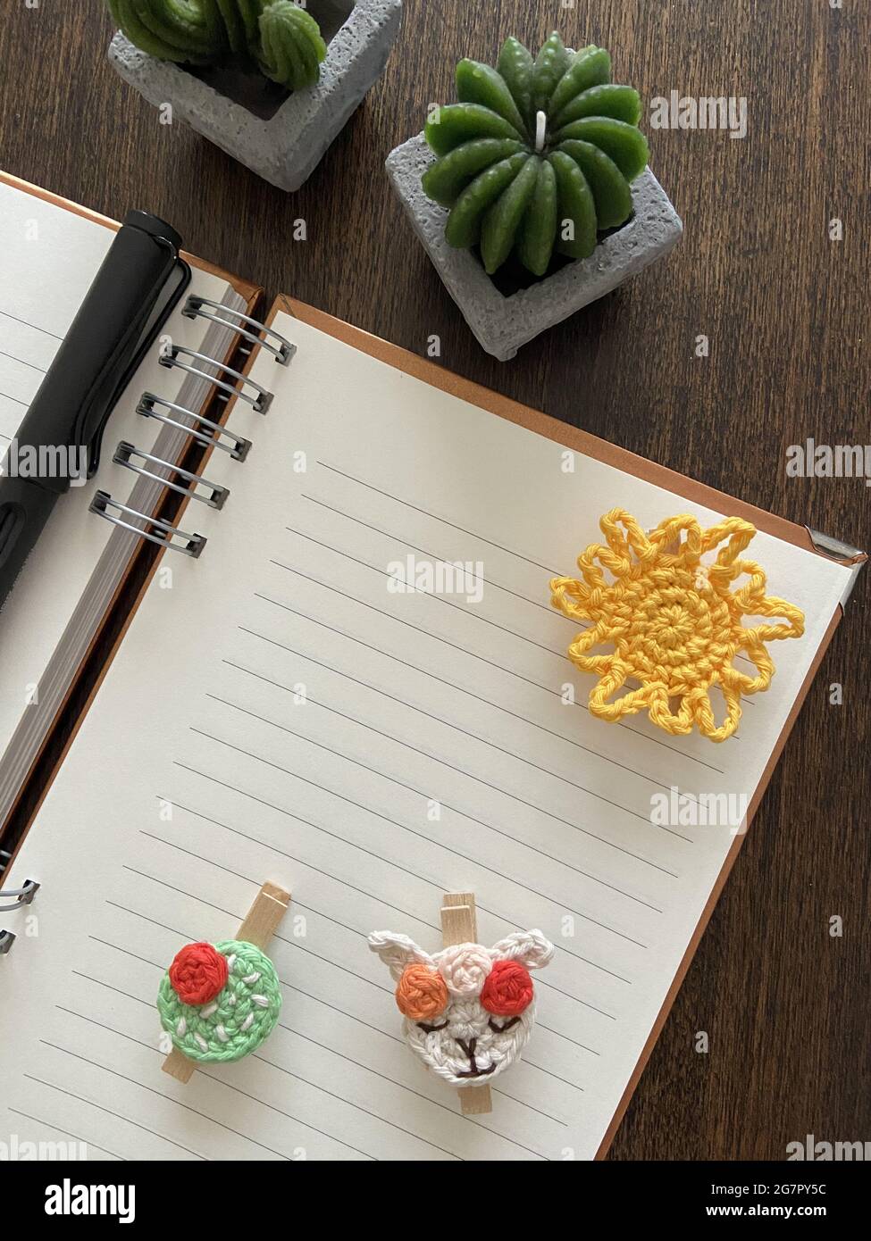 Vertical shot of a blank notepad with space for text on the table with ...