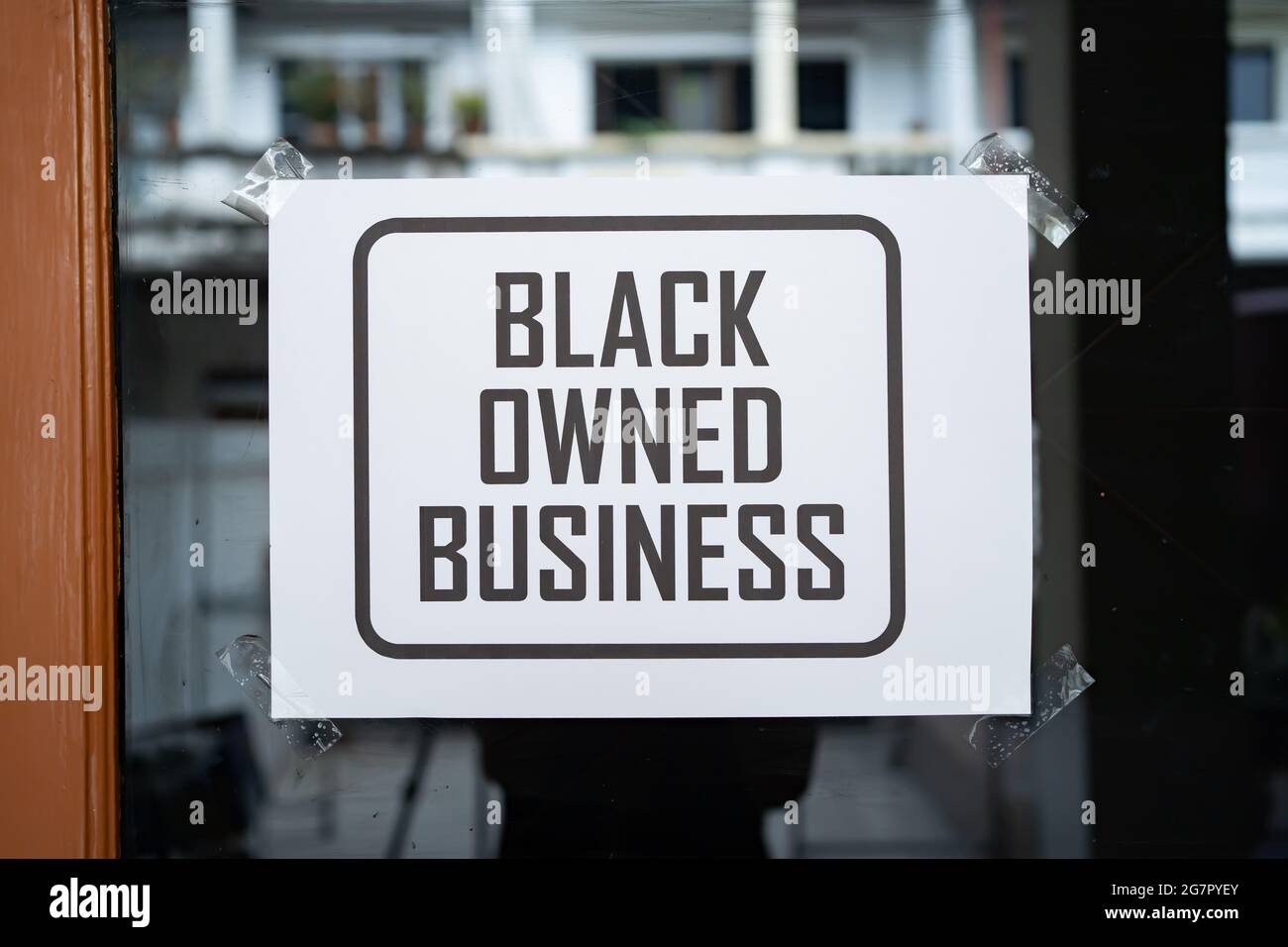 Black owned business sign on the window Stock Photo