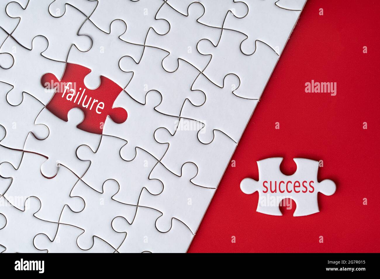 Business concept. Jigsaw puzzle with text failure and success on red background. Selective focus point Stock Photo