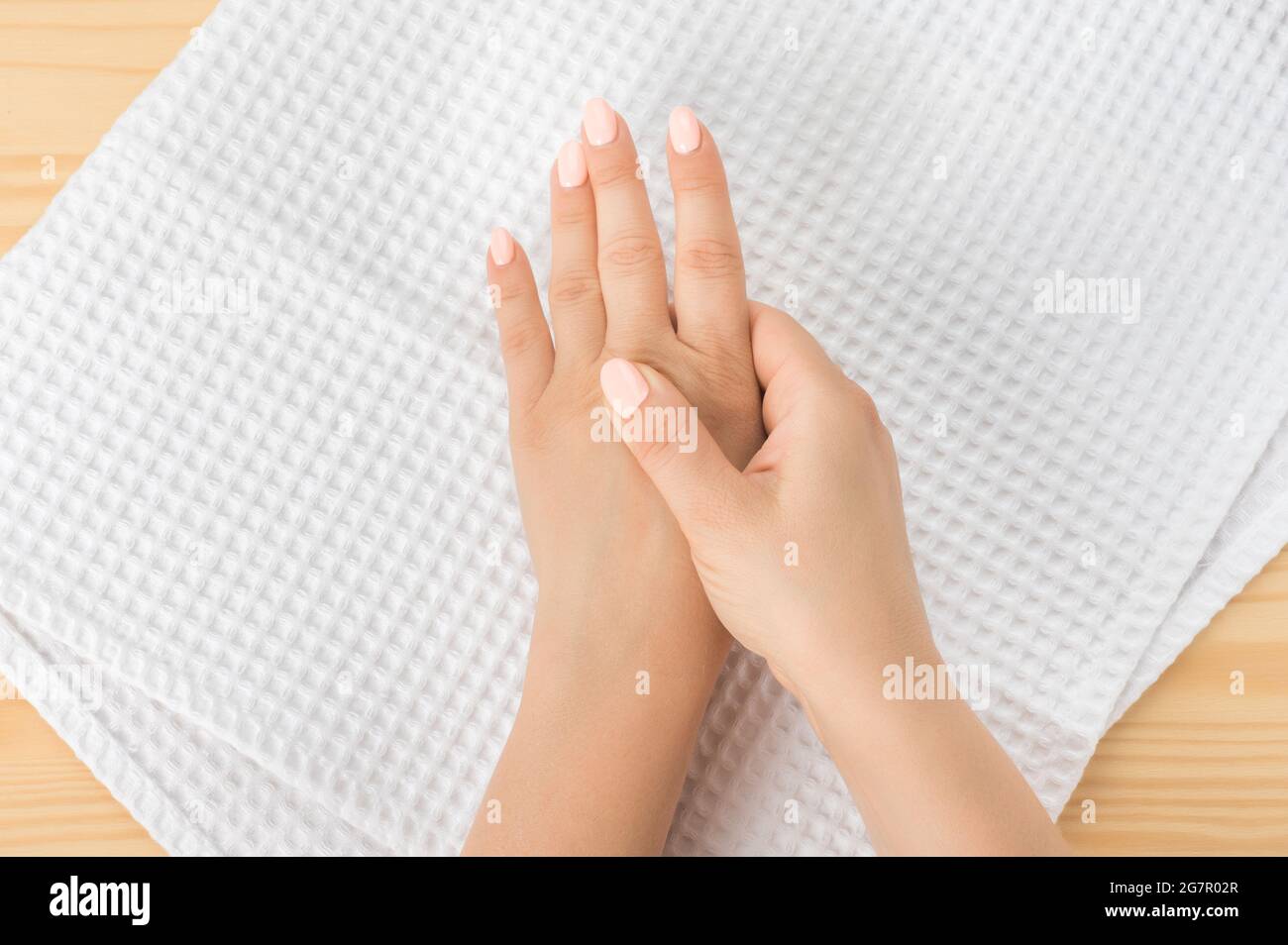 Self hand massage by caucasian young woman. Fingers and hand joint