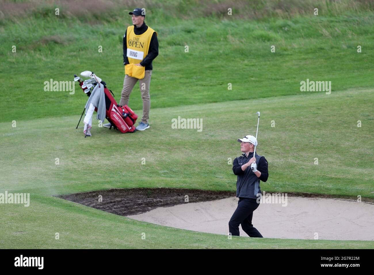 Denmark's Christoffer Bring chips out of a bunker on the 1st during day two of The Open at The Royal St George's Golf Club in Sandwich, Kent. Picture date: Friday July 16, 2021. Stock Photo