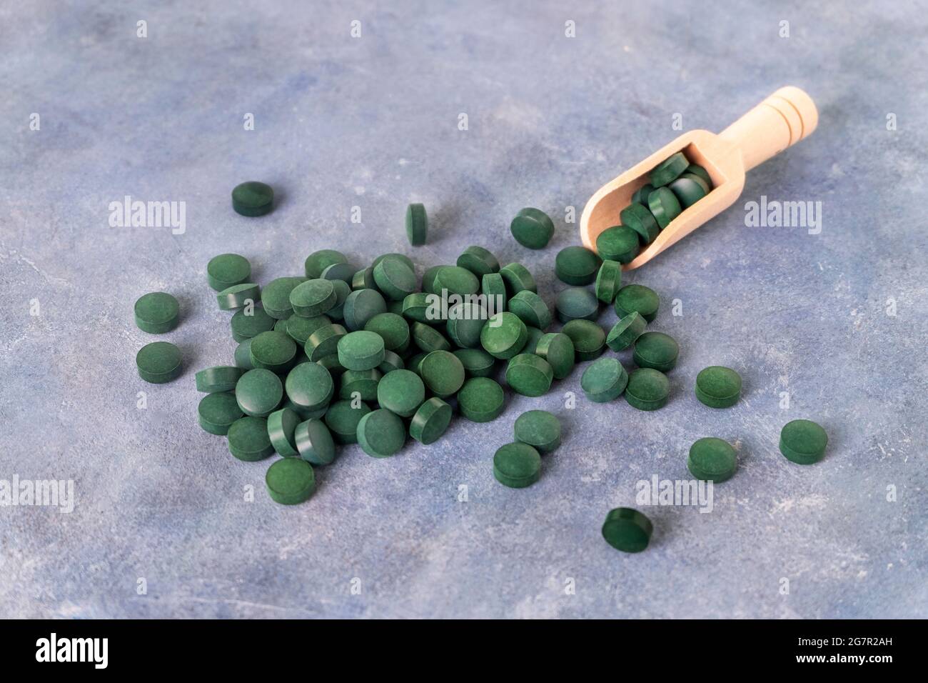 Green pills of spirulina or chlorella Stock Photo