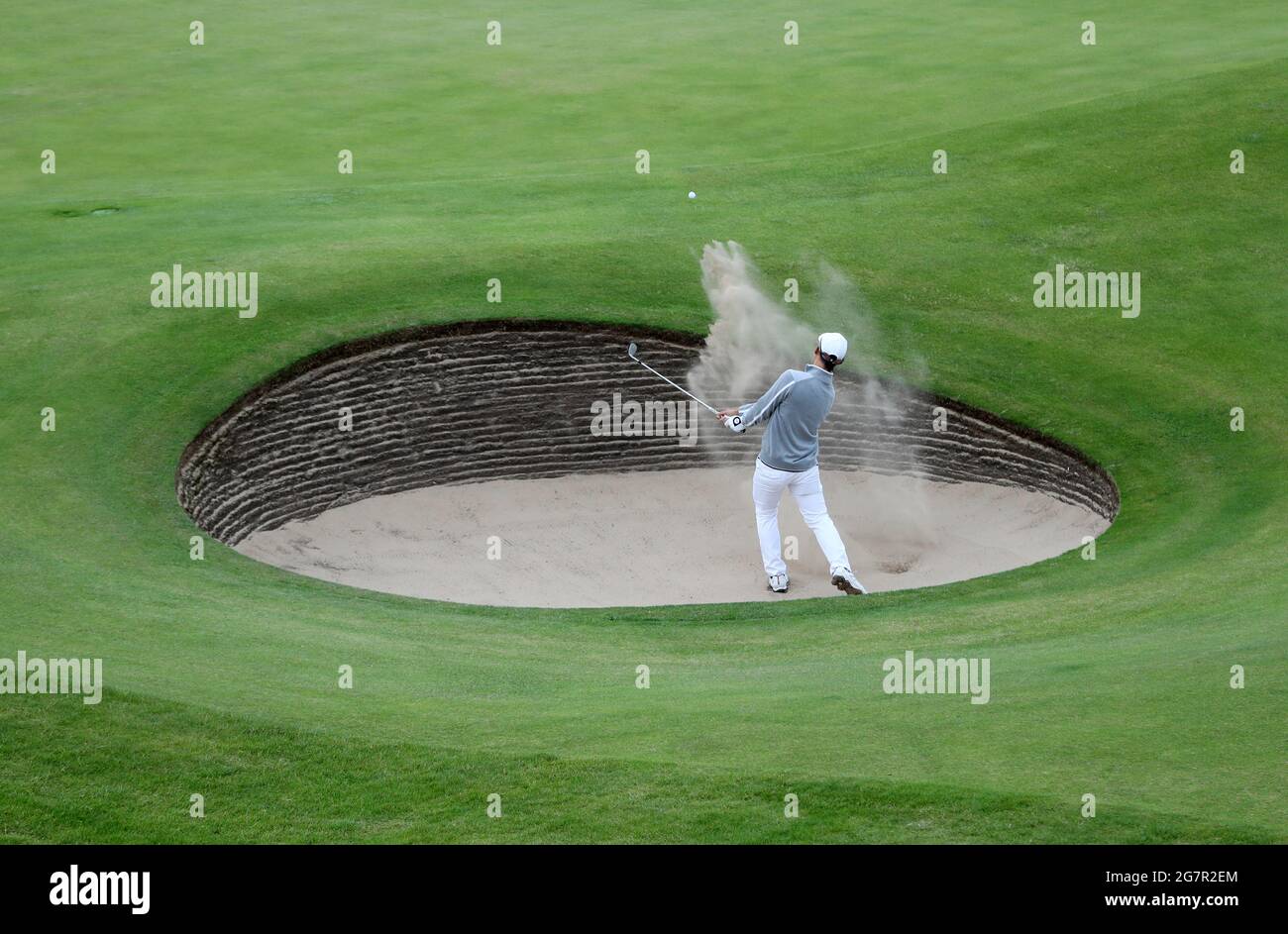 Thailand's Jazz Janewattananond chips out of a bunker during day two of The Open at The Royal St George's Golf Club in Sandwich, Kent. Picture date: Friday July 16, 2021. Stock Photo