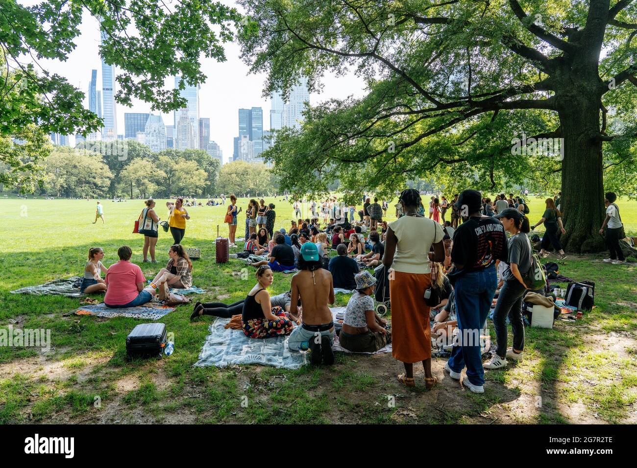 New York, USA. 11th July, 2021. People picnic on the great lawn in Central  Park. New York is well on its way to making up for its enforced Corona  timeout with a