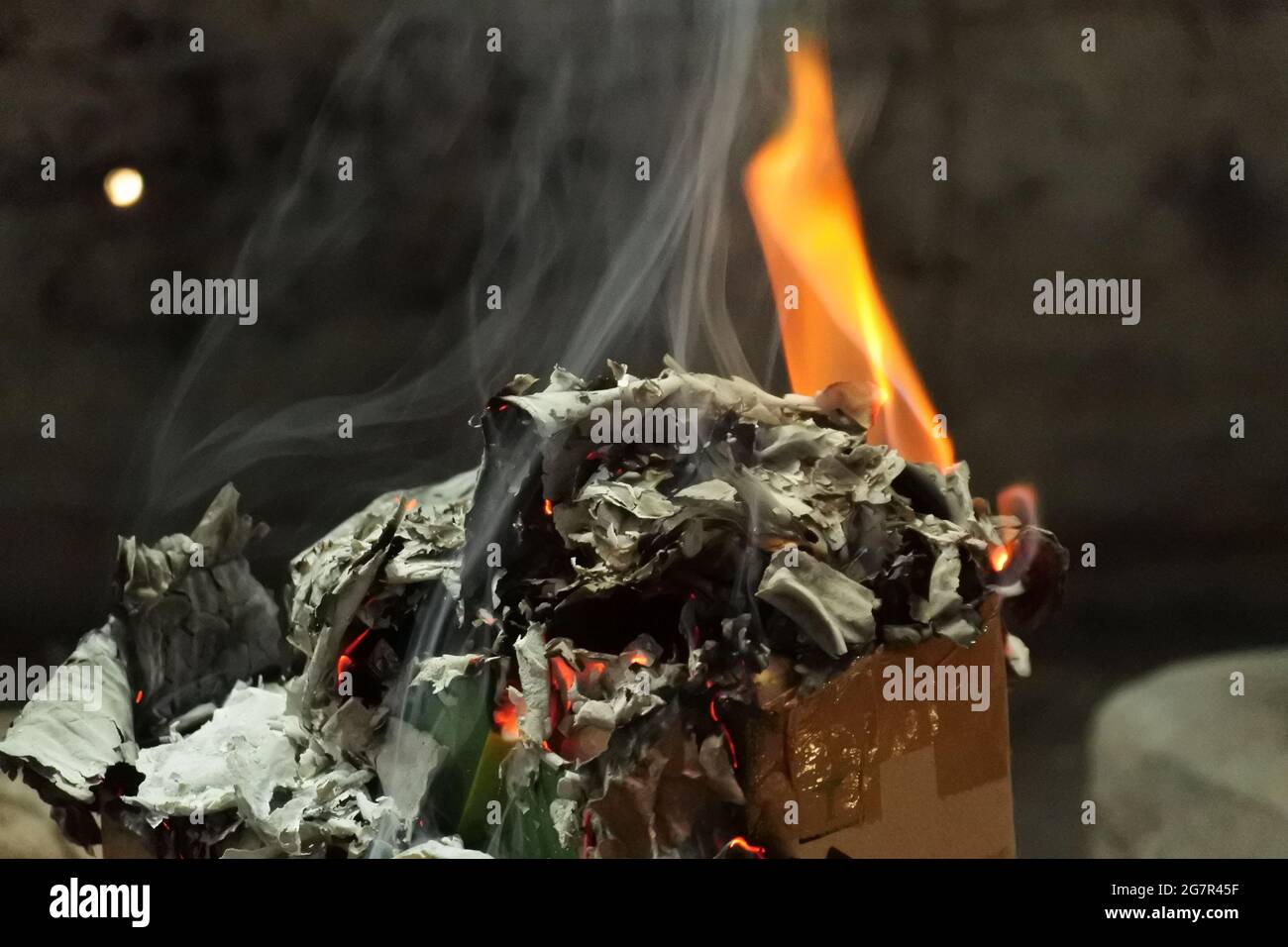 Selective focus shot of burning fire and its ashes Stock Photo