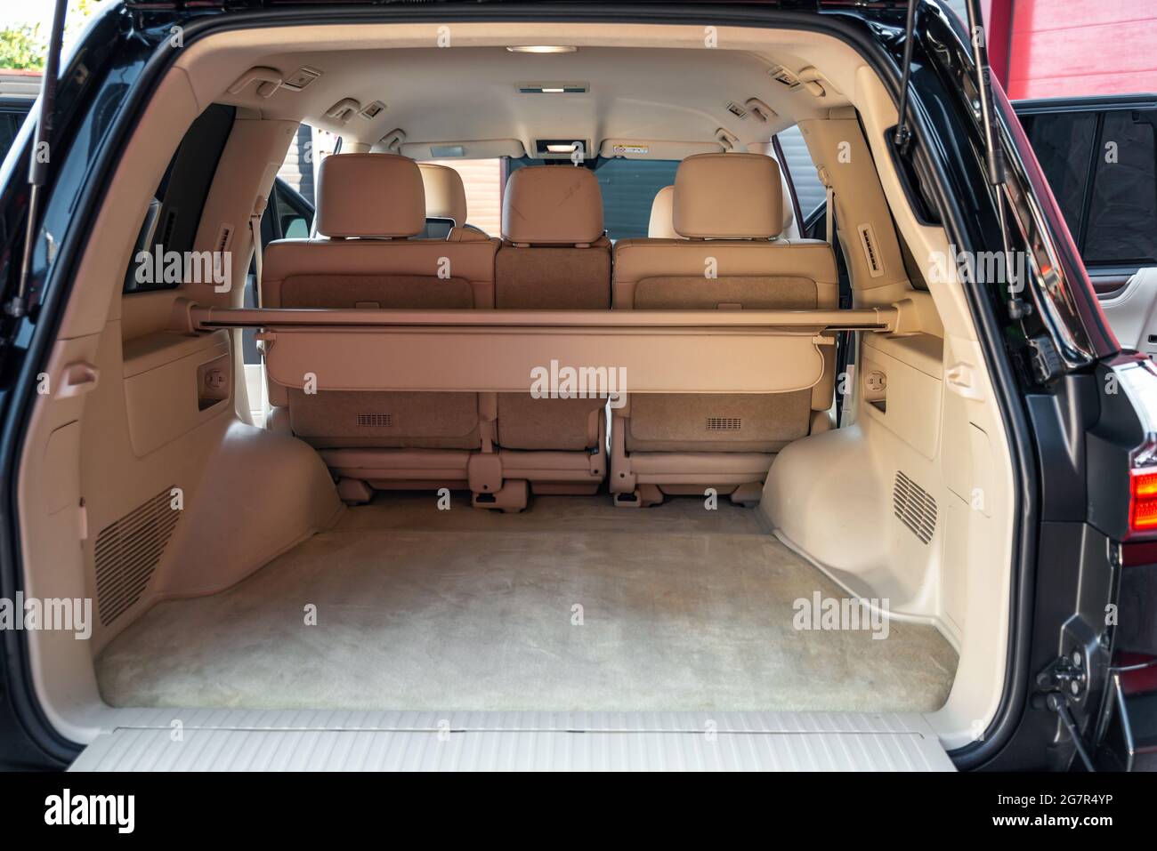 Rear view open car trunk. Large empty flat flor crossover car trunk close up. Huge suv trunk Stock Photo