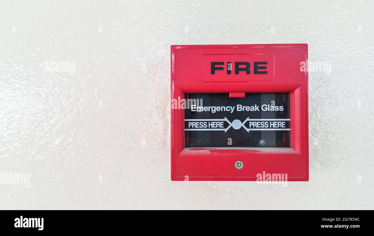 fire break glass on white wall background Stock Photo Alamy