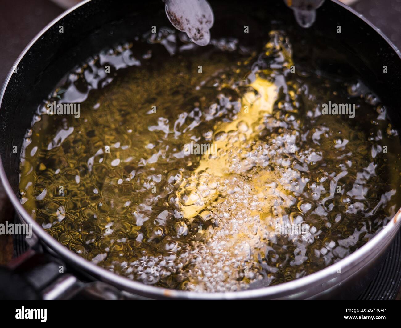 Close up of Frying french fries in the fryer in hot oil on the electric