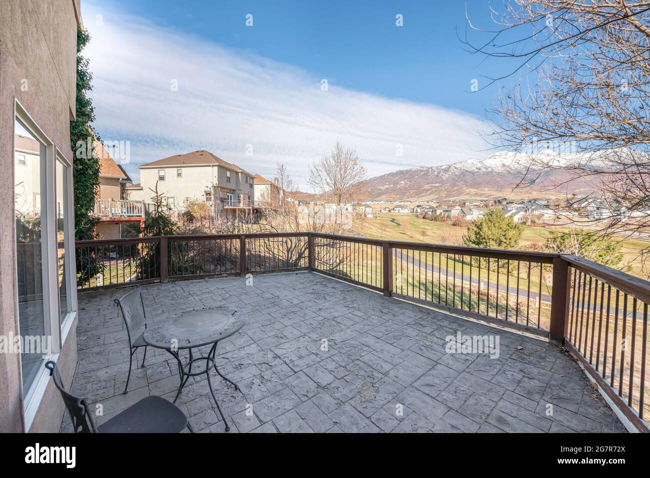 On a terrace of a house with a relaxing sky and mountain views Stock Photo